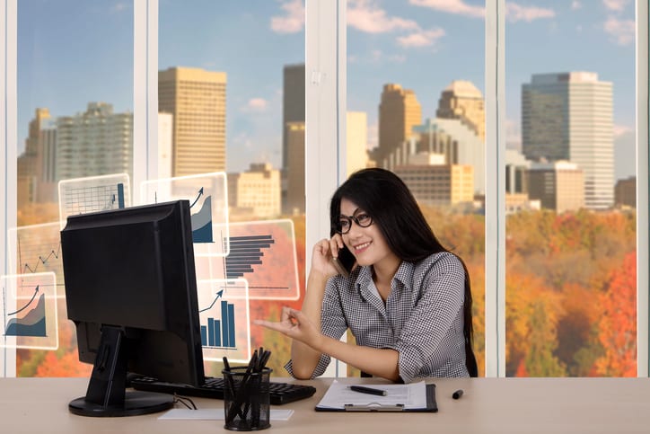 Palmetto Electrical Contractors | business woman talking on phone in front of a computer